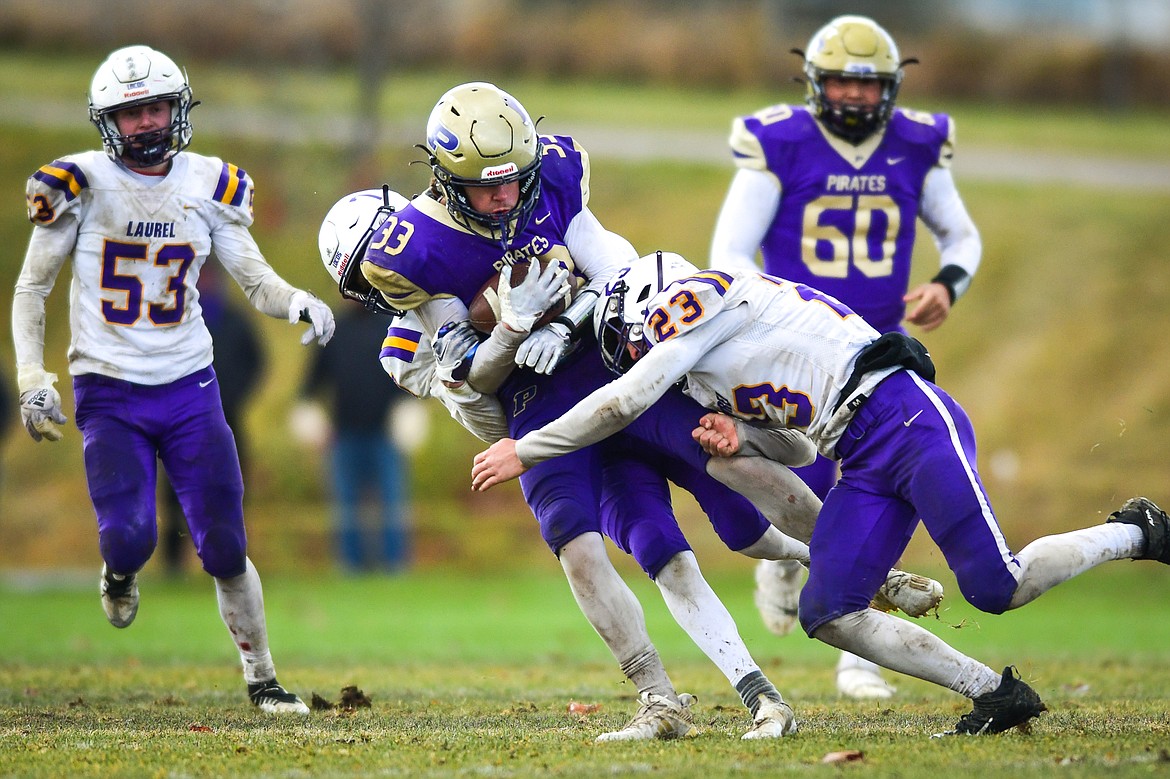 Polson running back Keyen Nash (33) is brought down after a reception in the fourth quarter against Laurel at Polson High School on Saturday, Nov. 5. (Casey Kreider/Daily Inter Lake)