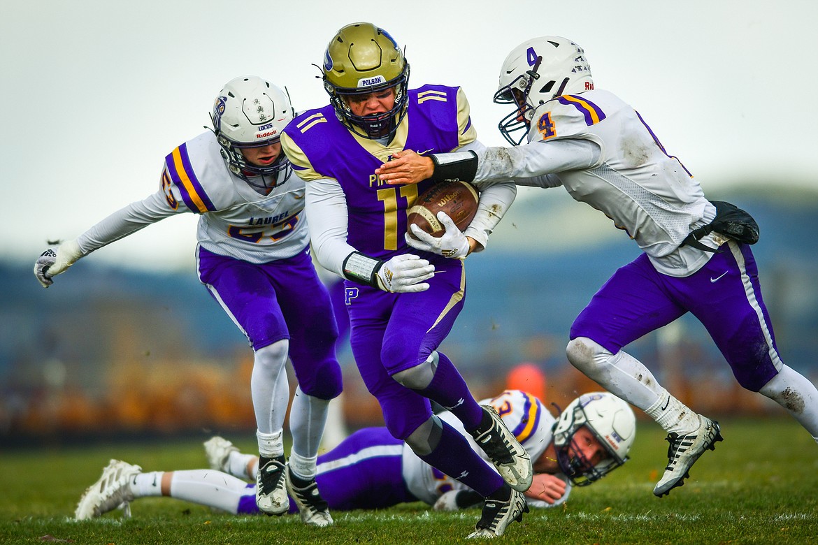 Polson wide receiver Dawson DuMont (11) picks up yardage after a reception in the first quarter against Laurel at Polson High School on Saturday, Nov. 5. (Casey Kreider/Daily Inter Lake)