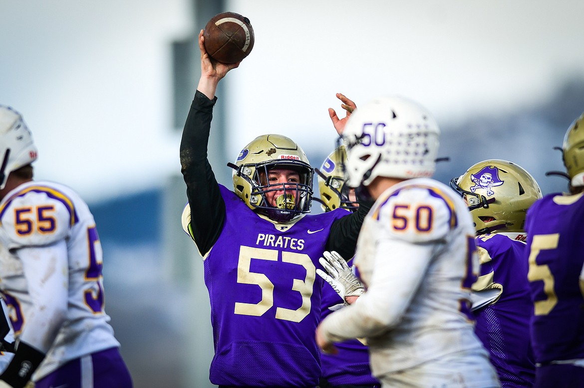 Polson defender Ezra Fasthorse (53) holds up the football after recovering a fumble in the third quarter against Laurel at Polson High School on Saturday, Nov. 5. (Casey Kreider/Daily Inter Lake)