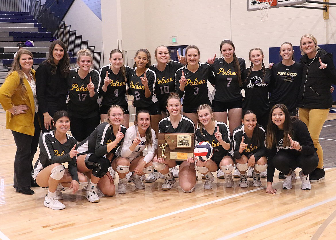 Members of the Polson Pirates pose with their second straight Western A Divisional volleyball championship trophy. Front row: Sierra Perez, Clara Todd, Julia Barnard, Grace Simonich, Lucy Violett, Samantha Rensvold and manager Tiana Walker. Back row: Assistant Bonnie Klein, head coach Lizzy Cox, Avery Starr, Hannah Simpson, Vivian Lazaro, Carli Maley, Mckenna Hanson, Izzy Fyant, Mgr. Gabriella Llac, Mgr. Kellyn Nelson and assistant Mariah Newell. (photo courtesy of Bob Gunderson)