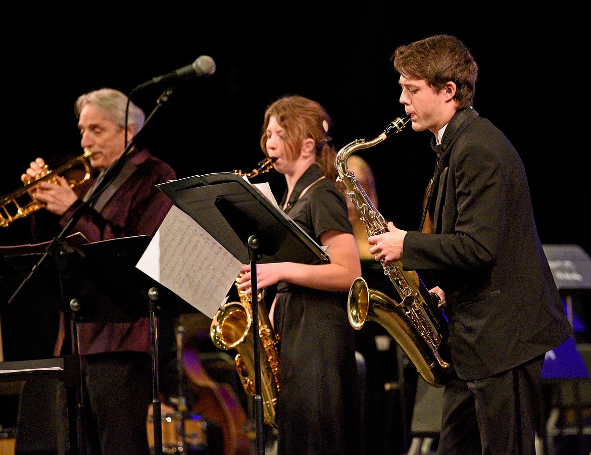 Members of the Whitefish High School Birdland Jazz Combo, Sasha Johnston and Henry Seigmund, perform alongside professional trumpeter Allen Vizzutti during a special concert at the Performing Arts Center in Whitefish on Thursday. (Whitney England/Whitefish Pilot)