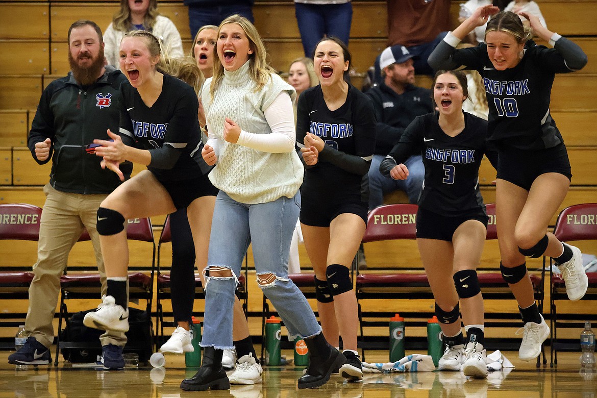 Bigfork head coach Ariel Stallknecht and the Valkyries bench celebrate after the final point of the Western B divisional semifinal in Florence on Friday, Nov. 5. (Jeremy Weber/Bigfork Eagle)