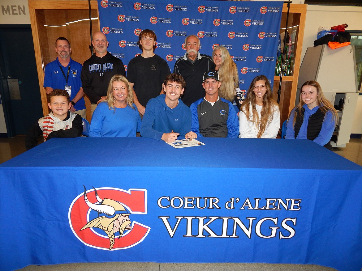 Courtesy photo
Coeur d'Alene High senior Bryce Stockton recently signed a letter of intent to play baseball at Tacoma Community College. Seated from left are MJ Stockton, brother; Shayna Stockton, mom; Bryce Stockton; Jon Stockton, dad; Bayleigh Stockton, sister; Lily Abell, girlfriend; and standing from left, Bill White, Coeur d'Alene High athletic director; Erik Karns, Coeur d'Alene High head baseball coach; Andrew Murphy, friend; Michael Quick, grandfather; and Sherry Quick, grandmother.