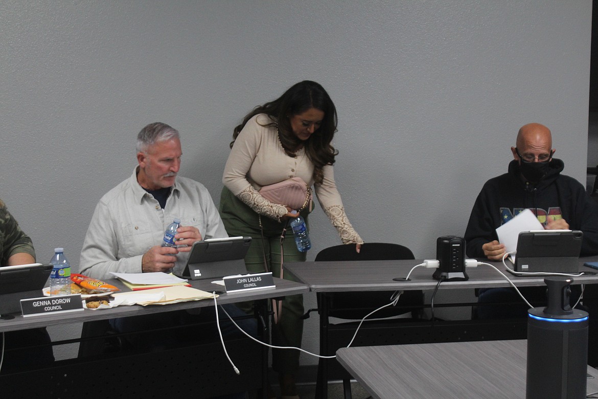 New Othello City Council member Danae Valdez takes her seat during Monday’s meeting between council members John Lallas, left, and Corey Everett, right. Valdez was sworn into office before seating herself with the rest of the council.