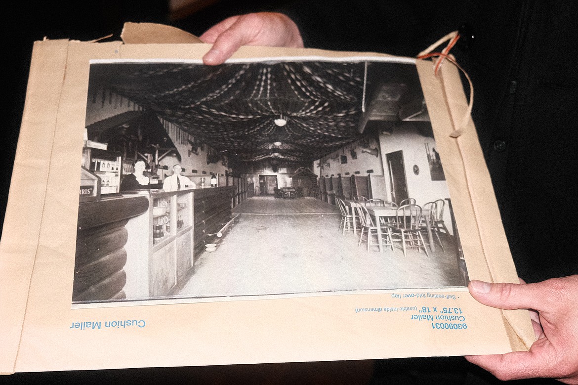 The Ritz operations manager Ben Stodghill holds a photo that the business is using for reference in their downstairs speakeasy renovation. (Adrian Knowler/Daily Inter Lake)