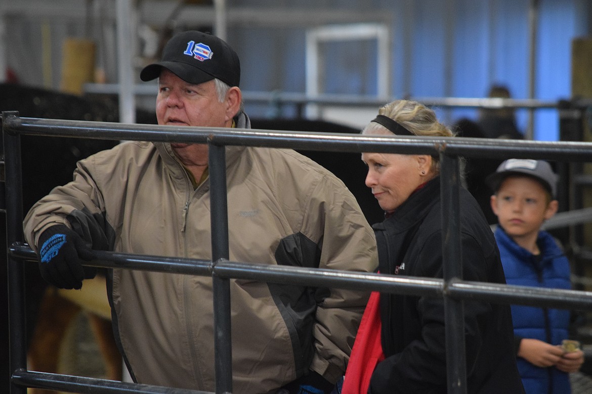 Moses Lake rancher Floyd Lewis and his wife Rae Ann stand at the exit gate of the show ring at the Western Showcase Jackpot on Saturday. Grant County Cattlerancher of the Year, Lewis said he called to volunteer and help with the show at the very last minute.