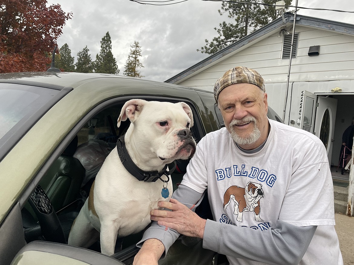 After moving out of his Columbia Falls, Montana, home, which he can no longer afford, Kim Hilton plans to live in his truck with his dog, Amora, while he waits for a spot at an assisted living facility to open up. (Aaron Bolton/Montana Public Radio)