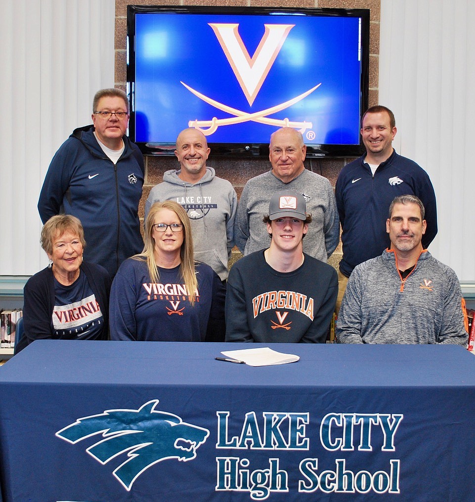 Courtesy photo
Lake City High senior Blake Buchanan recently signed a letter of intent to play basketball at the University of Virginia. Seated from left are Carol Martin (grandmother), Debbie Buchanan (mom), Blake Buchanan and Gayle "Buck" Buchanan (dad); and standing from left, Jim Winger, Lake City boys basketball coach; Kelly Reed, Lake City assistant boys basketball coach; John Astorquia, Lake City assistant boys basketball coach; and Troy Anderson, Lake City athletic director.