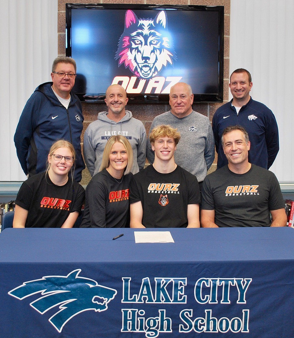 Courtesy photo
Lake City High senior Nathan Hocking recently signed a letter of intent to play basketball at NAIA Ottawa University in Surprise, Ariz. Seated from left are Josie Hocking (sister), Lynn Hocking (mom), Nathan Hocking and Justin Hocking (dad); and standing from left, Jim Winger, Lake City boys basketball coach; Kelly Reed, Lake City assistant boys basketball coach; John Astorquia, Lake City assistant boys basketball coach; and Troy Anderson, Lake City athletic director.