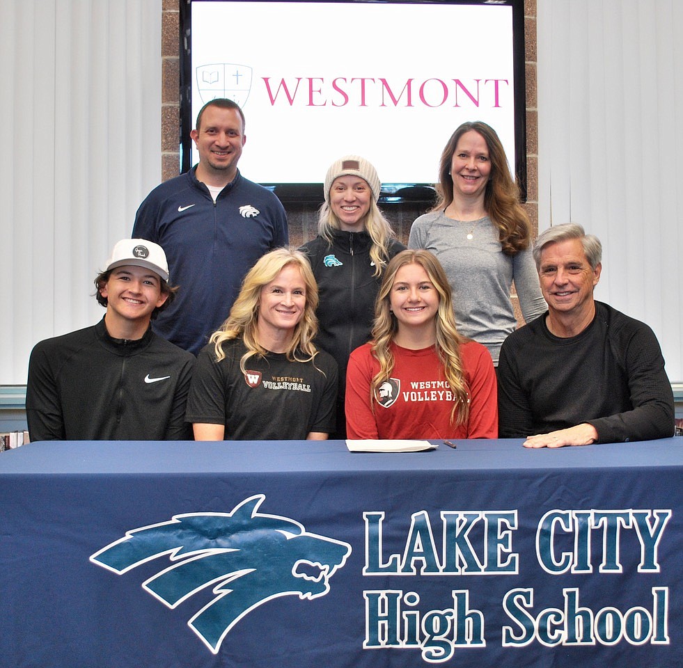 Courtesy photo
Lake City High senior Ella Hosfeld recently signed a letter of intent to play volleyball at NAIA Westmont College in Santa Barbara, Calif. Seated from left are Max Hosfeld (brother), Jaimie Lee (mom), Ella Hosfeld and Tom Hickcox (stepdad); and standing from left, Troy Anderson, Lake City athletic director; Michelle Kleinberg, Lake City volleyball coach; and Nicole Rayborn, club volleyball coach.