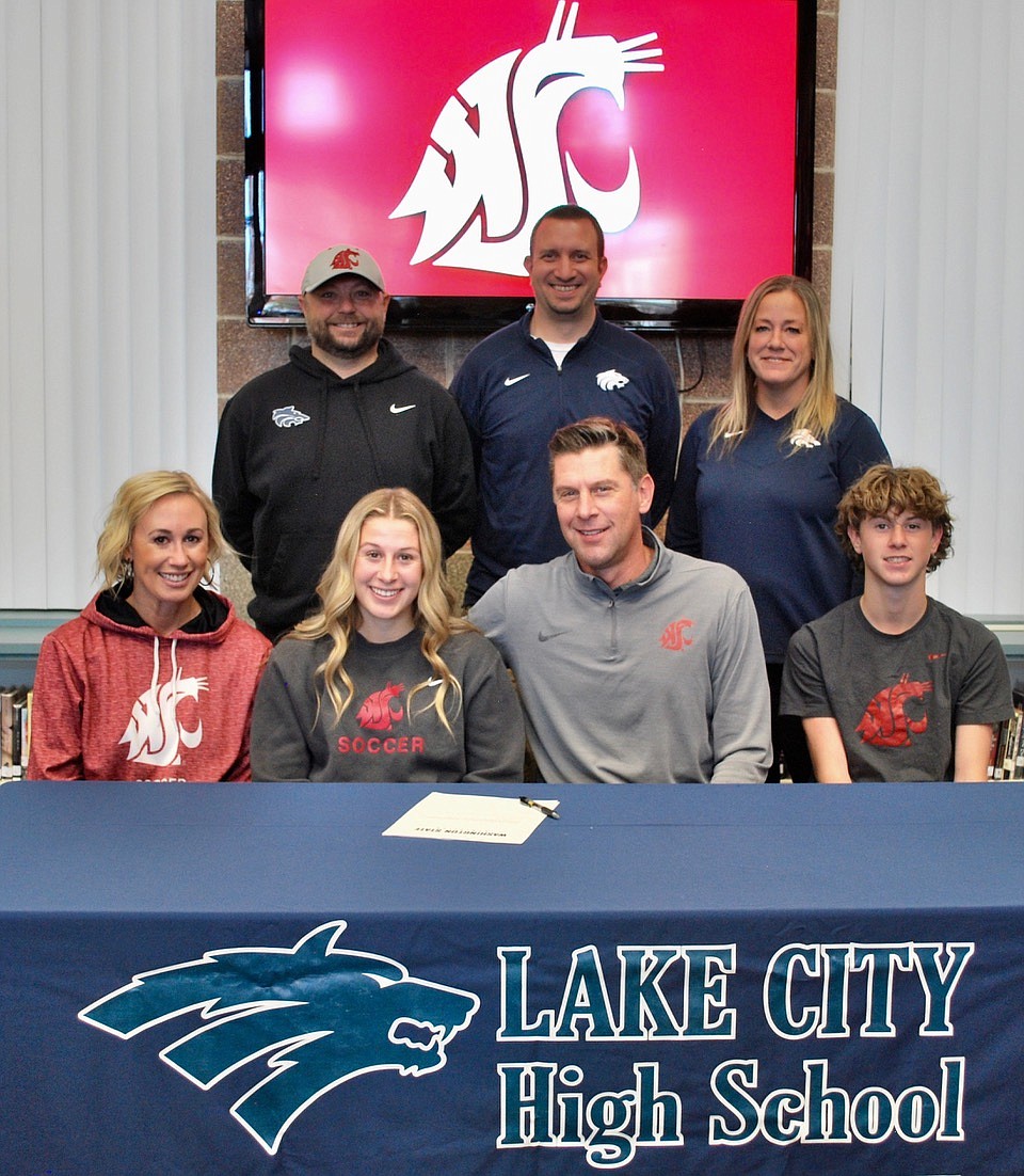 Courtesy photo
Lake City High senior Elliotte Kortus recently signed a letter of intent to play soccer at Washington State. Seated from left are Rachelle Kortus (mom), Elliotte Kortus, Taft Kortus (dad) and Greyson Kortus (brother); and standing from left, Matt Ruchti, Lake City head girls soccer coach; Troy Anderson, Lake City athletic director; and Laura Tolzmann, Lake City assistant girls soccer coach.