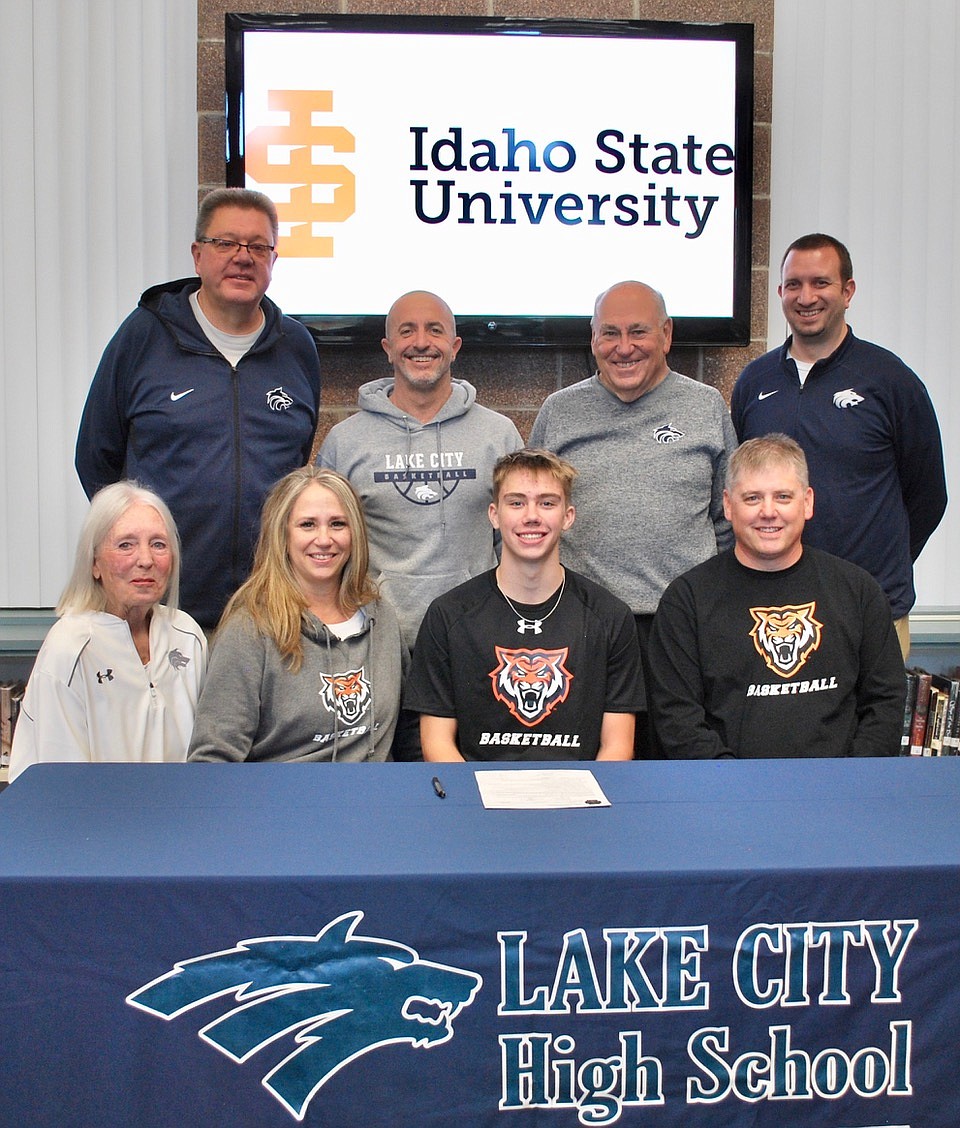 Courtesy photo
Lake City High senior Kolton Mitchell recently signed a letter of intent to play basketball at Idaho State University. Seated from left are Rosie Astorquia (family friend), Karla Mitchell (mom), Kolton Mitchell and Keith Mitchell (dad); and standing from left, Jim Winger, Lake City boys basketball coach; Kelly Reed, Lake City assistant boys basketball coach; John Astorquia, Lake City assistant boys basketball coach; and Troy Anderson, Lake City athletic director.