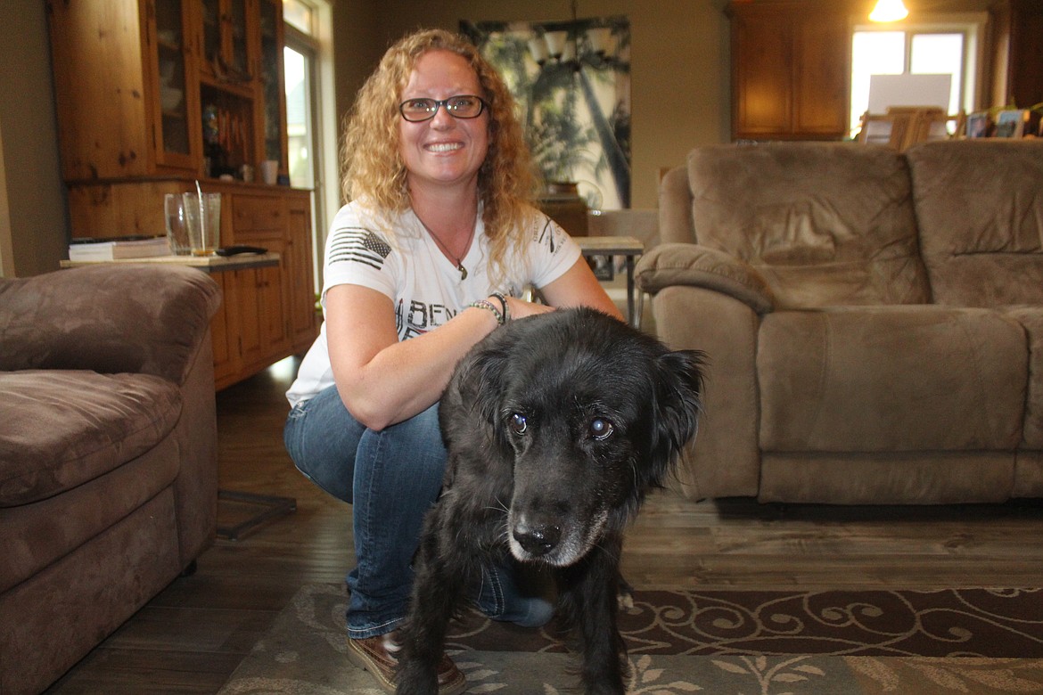 Nicole O’Shea with her service dog Socks, who has been with her through her sometimes difficult recovery from a traffic collision that prematurely ended her military service.