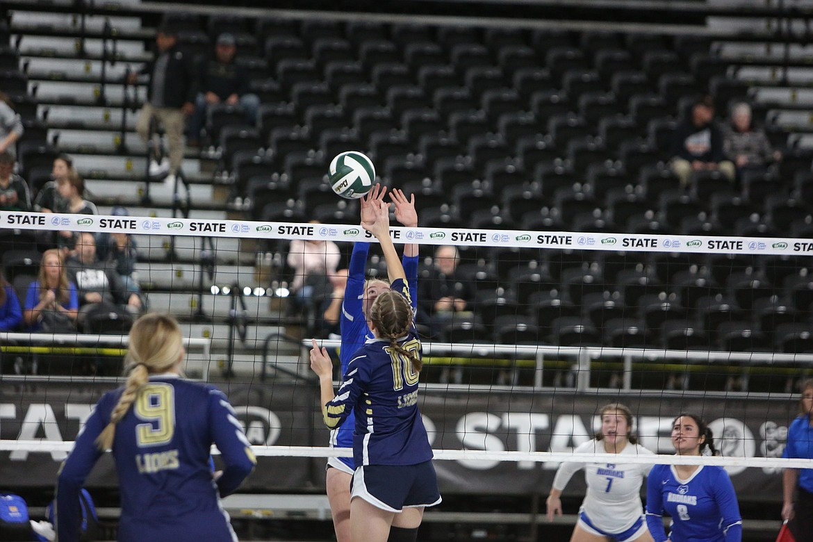 MLCA/CCS junior Maria Gulenko tips the ball past a Columbia Adventist blocker in the Lions’ 3-1 win Thursday morning.