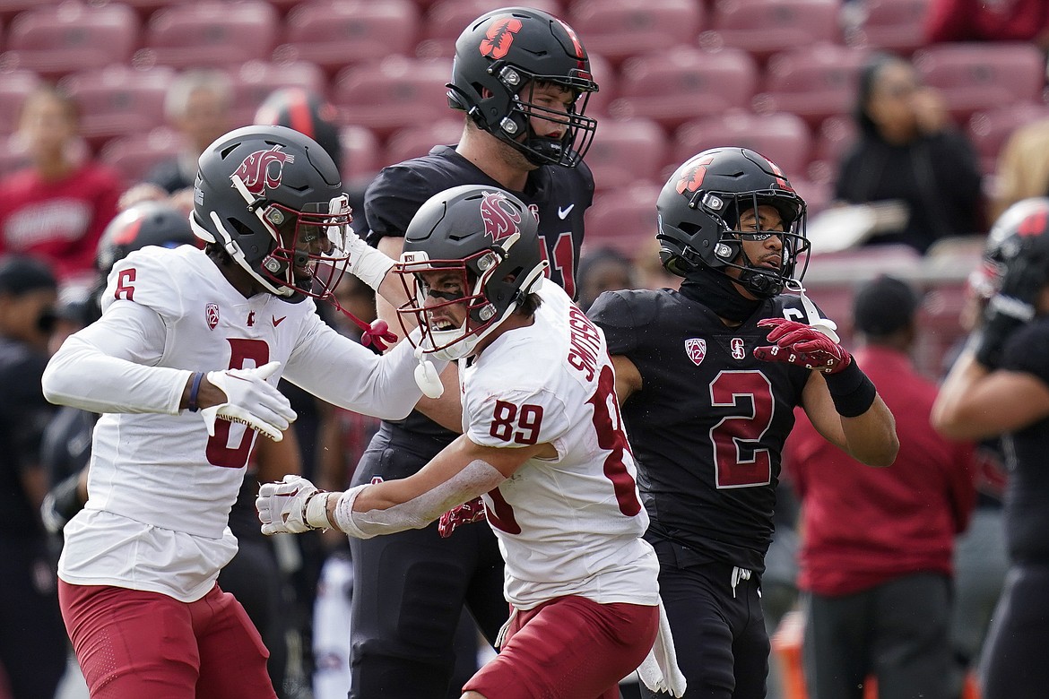 WSU receiver Leyton Smithson (89) celebrates with his teammate Donovan Ollie (6) after scoring a touchdown in the Cougars’ 52-14 win over Stanford last week. Smithson made his first career start in the win.