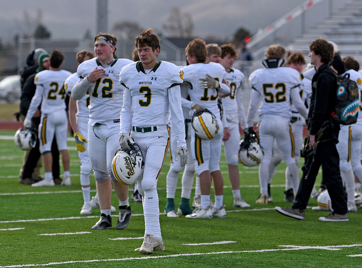 Bulldog players disappointed after falling to the Broncs in a quarterfinal playoff game against Hamilton Saturday. (Whitney England/Whitefish Pilot)