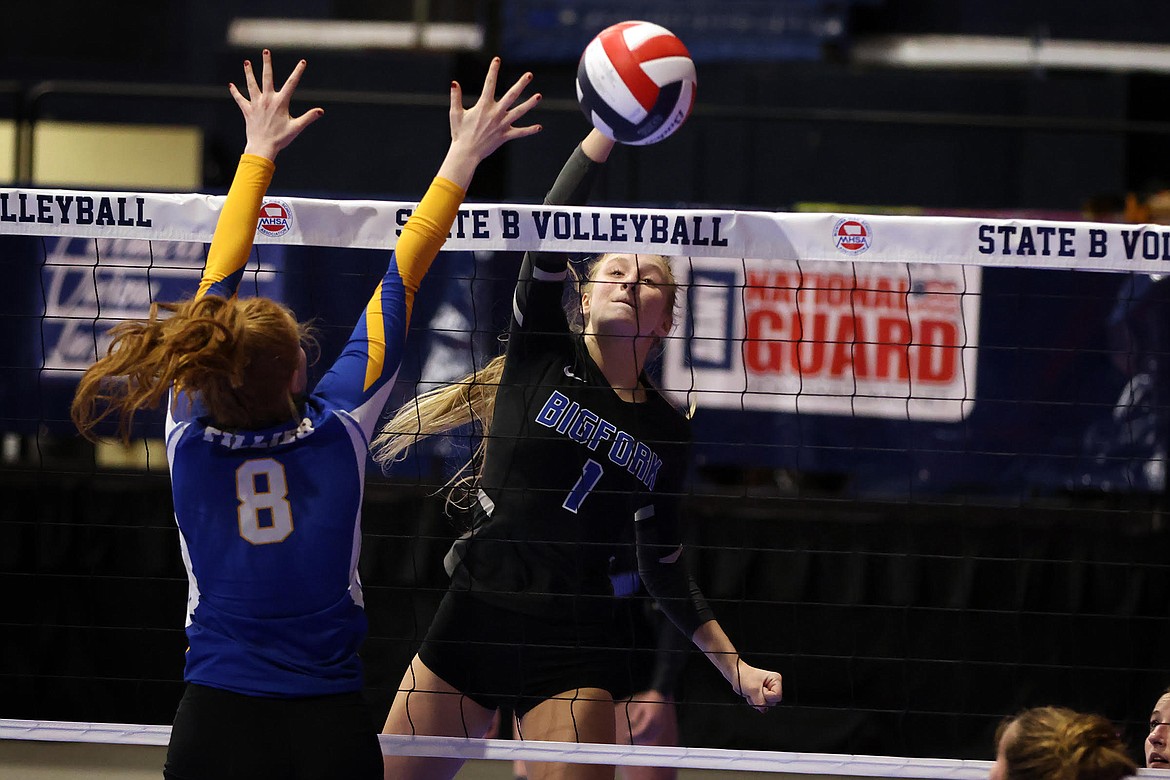 Bigfork's Inga Turner sends the ball past Shepherd's Brianna Olstad for a kill during action at the State Volleyball Tournament in Bozeman Thursday, Nov. 10. (Jeremy Weber/Daily Inter Lake)