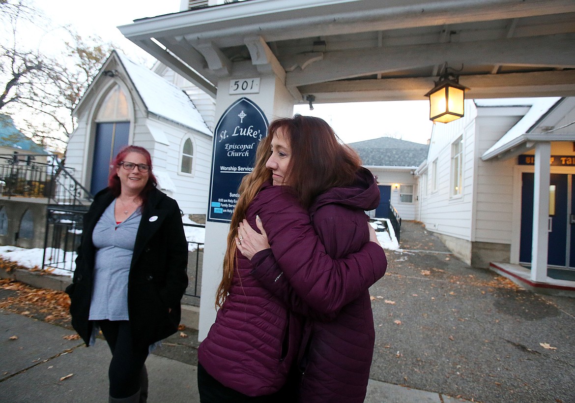 Family Promise of North Idaho Executive Director Cindy Wood receives a big hug from Brooke Carroll on Thursday evening. Carroll and her family have been clients of Family Promise for about three months. A local donor gifted them a reliable used vehicle after they could not afford thousands of dollars for repairs when their old car broke down.