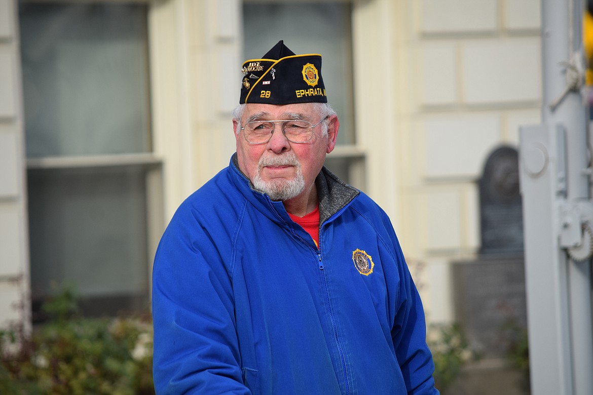Organizer of the Ephrata Veterans Day Parade and Marine Corps veteran Mike Montaney stands in front of the Grant County Courthouse on Friday as the annual parade makes its way to the courthouse Vietnam War Memorial