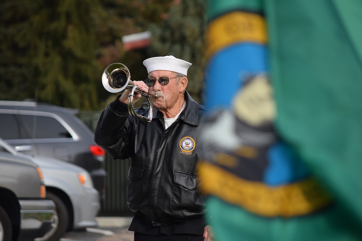 A member of the American Legion Post 28 honor guard plays taps at the Vietnam War Memorial in front of the Grant County Courthouse in Ephrata at the conclusion of Friday’s annual Veterans Day Parade.