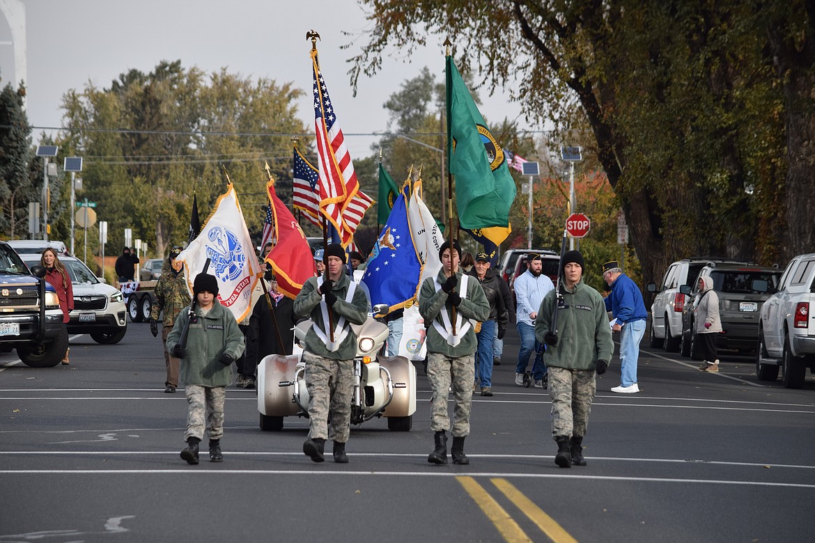 Cadets with the Civil Air Patrol’s Columbia Basin Composite Squadron carry the colors as the annual Veterans Day Parade steps off in front of the Grant County Courthouse in Ephrata in Friday.