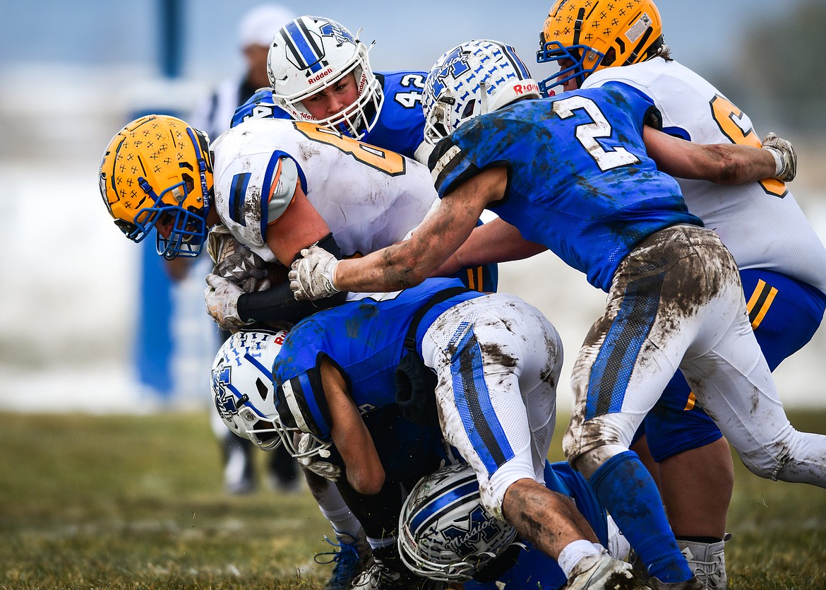 Mission defenders bring down Fairview running back Hunter Sharbono (85) in the second quarter at St. Ignatius High School on Saturday, Nov. 12. (Casey Kreider/Daily Inter Lake)