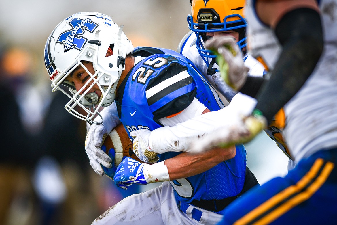 Mission tight end Kenny Ness (25) is brought down after a reception in the second quarter against Fairview at St. Ignatius High School on Saturday, Nov. 12. (Casey Kreider/Daily Inter Lake)