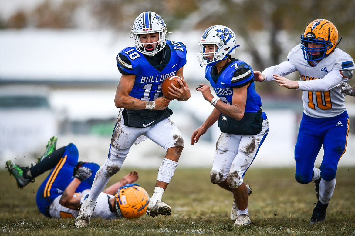 Mission quarterback Kellen McClure (10) picks up yardage on a run in the second quarter against Fairview at St. Ignatius High School on Saturday, Nov. 12. (Casey Kreider/Daily Inter Lake)