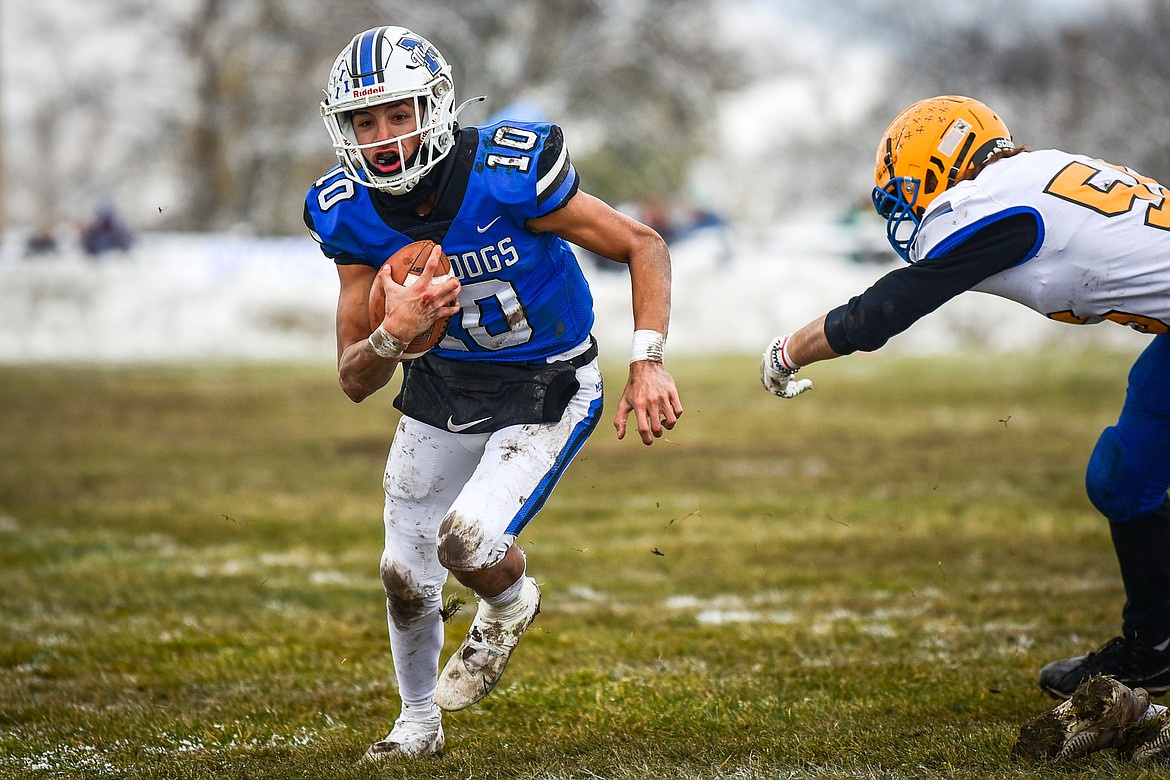 Mission quarterback Kellen McClure (10) picks up yardage on a run in the second quarter against Fairview at St. Ignatius High School on Saturday, Nov. 12. (Casey Kreider/Daily Inter Lake)