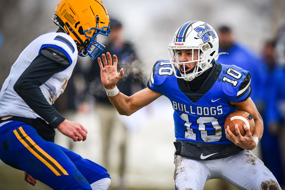 Mission quarterback Kellen McClure (10) picks up yardage on a run in the second quarter against Fairview at St. Ignatius High School on Saturday, Nov. 12. (Casey Kreider/Daily Inter Lake)