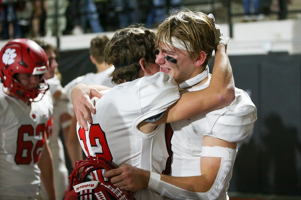 Teammates Ryder Haynes and Parker Pettit embrace following the game.