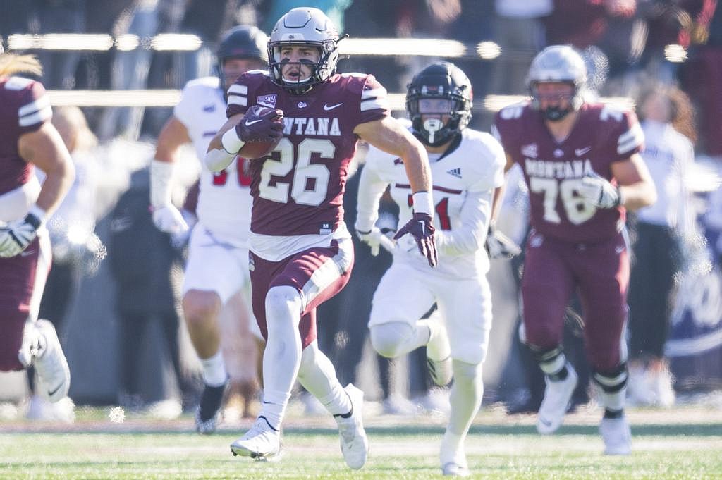 Nick Ostmo of the Montana Grizzlies runs for a touchdown during a college football game against the Eastern Washington Eagles at Washington-Grizzly Stadium on November 12 in Missoula, Montana. (Tommy Martino/UM Athletics)