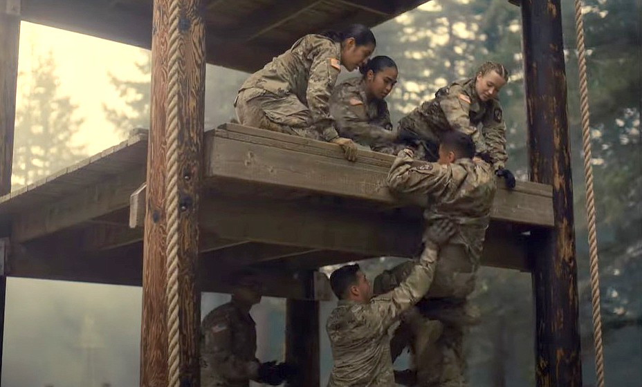 In this still from the promotional video “So Early,” 2nd Lt. Perdro Popoca is shown climbing an obstacle course structure with some help from cadets.