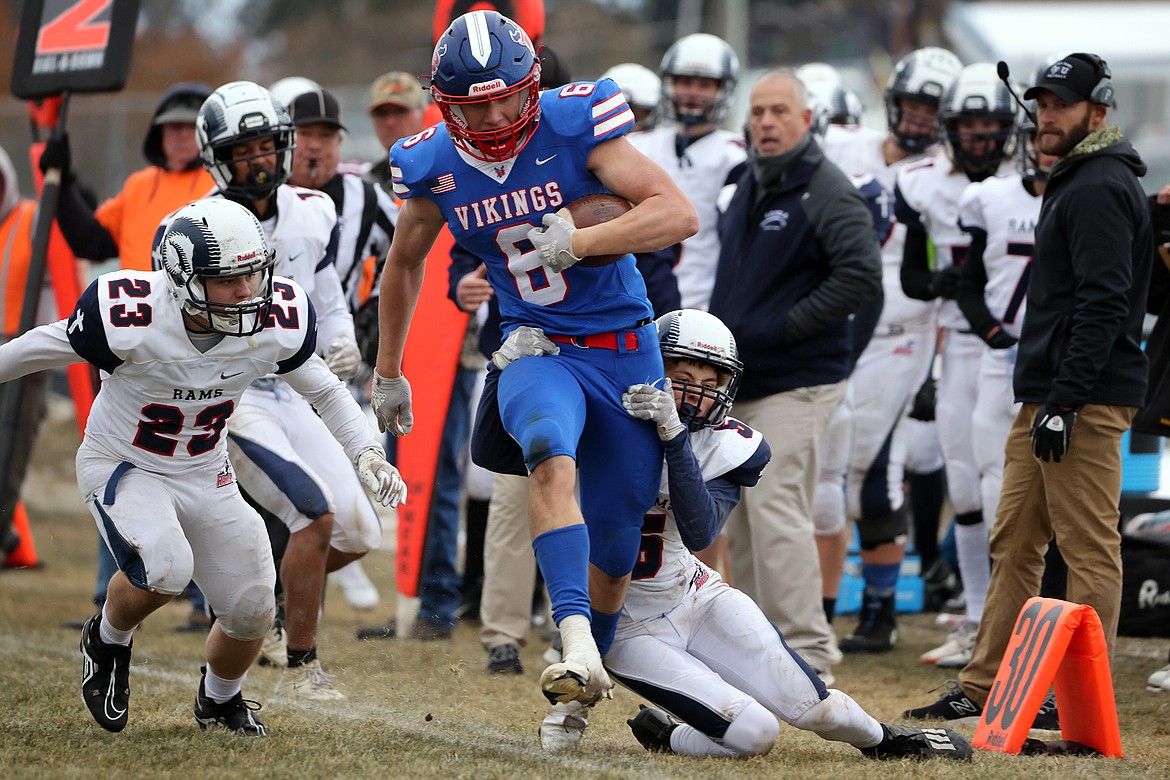 Bigfork’s Nick Walker fights for yards along the sideline in the Vikings 14-6 loss to Loyola in the State B semifinals Saturday, Nov. 12. (Jeremy Weber/Daily Inter Lake)