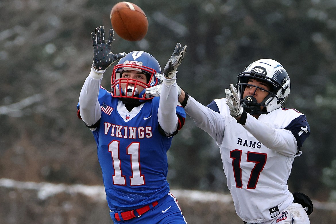 Viking Landon Byerman battles Loyola’s Malik Lyttle for a pass in the State B semifinals in Bigfork Saturday Nov. 12. (Jeremy Weber/Daily Inter Lake)