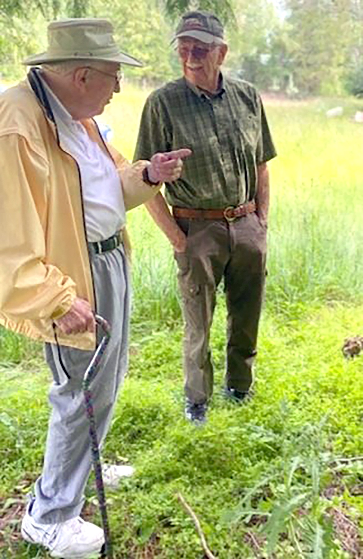 Gary Pietsch and Fritz Holz reminisce on good times on the Pine Street Hill during a visit to the sled hill property in the spring 2022.
