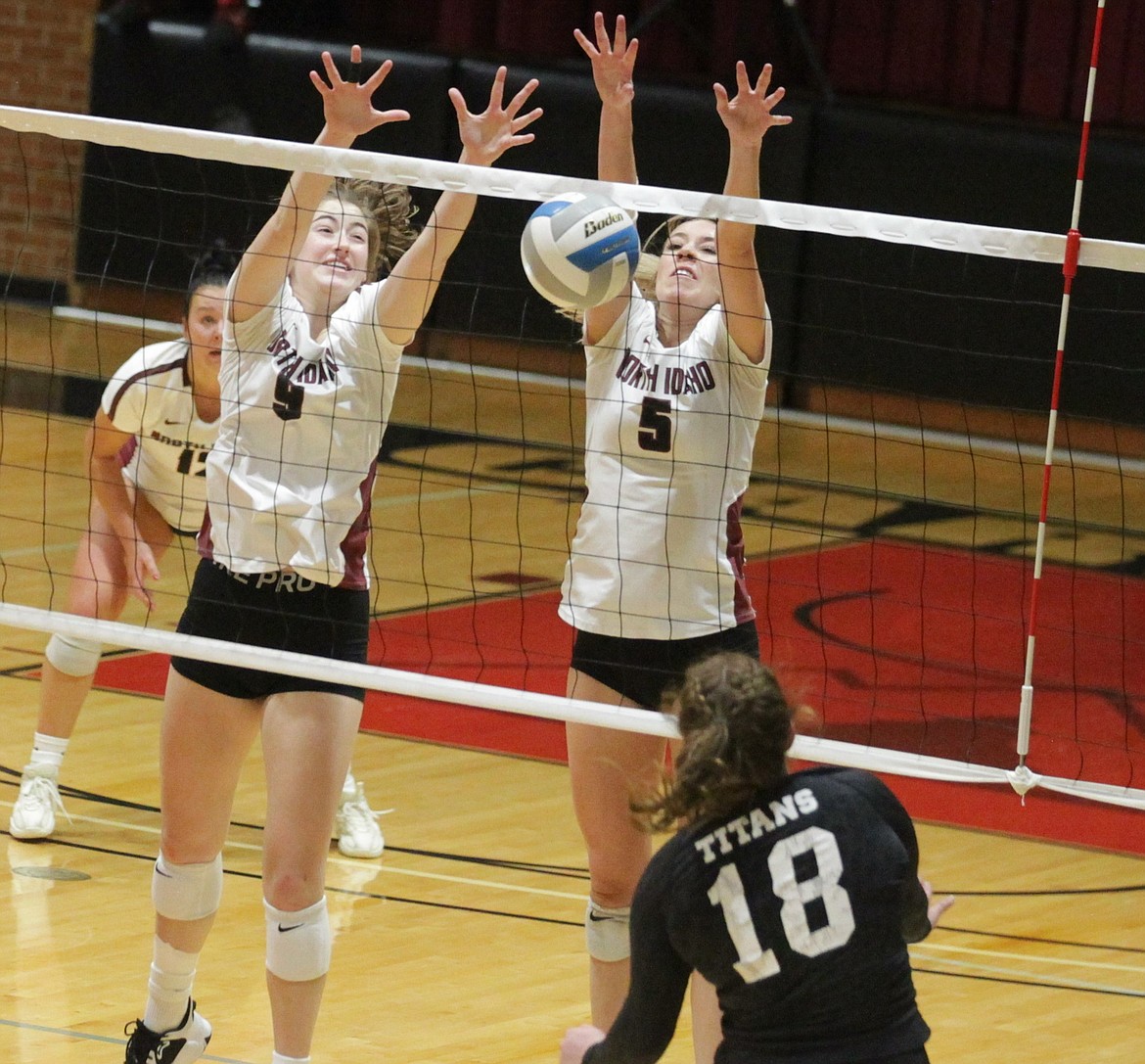 JASON ELLIOTT/Press
North Idaho College freshman middle blocker Rylee Hartwig (9) and freshman outside hitter Rachael Stacey (5) jump to prevent a Tacoma kill during Saturday's match at Christianson Gymnasium.