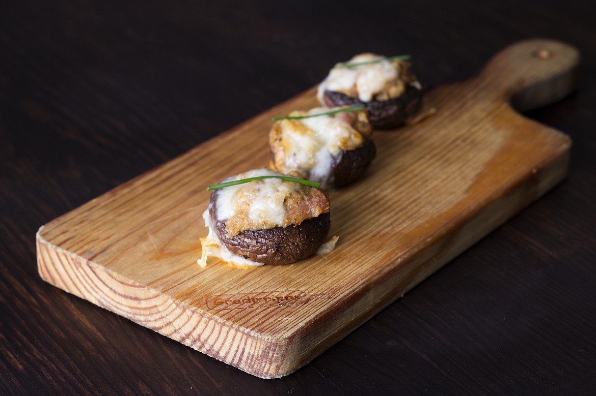 Stuffed mushrooms are a delight on the holiday buffet tables — and are a snap to make.