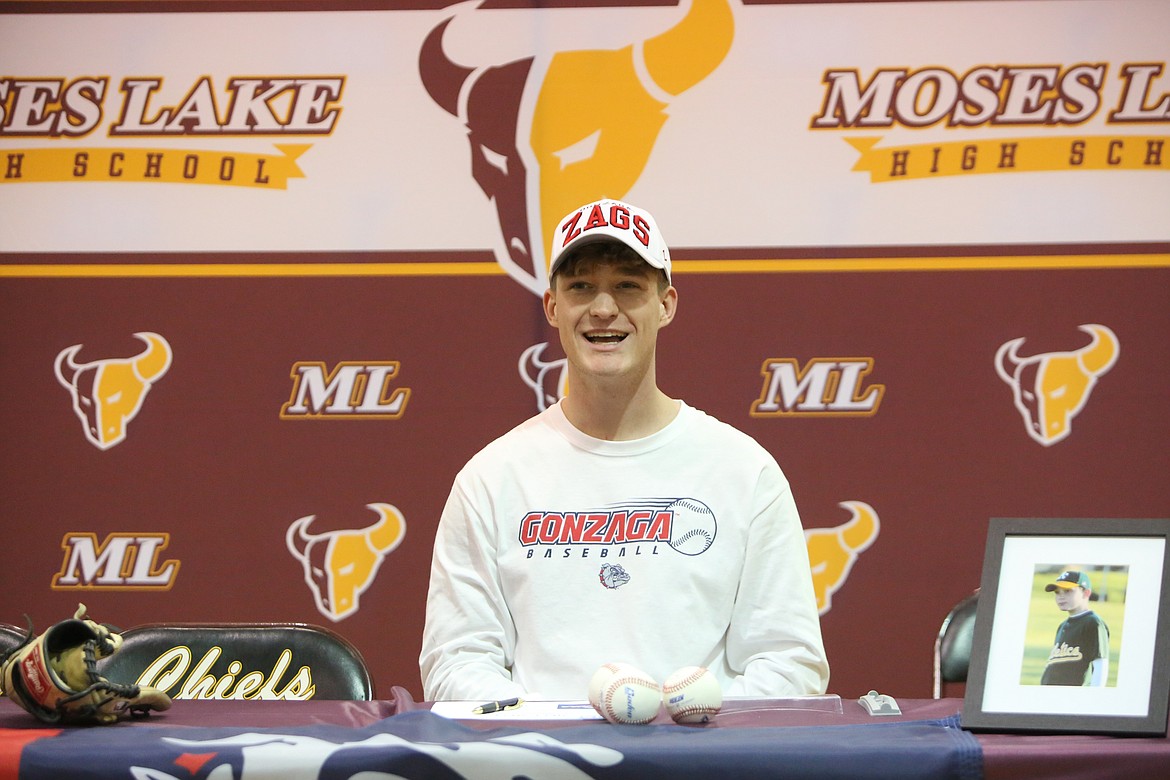 Moses Lake senior Michael Getzinger smiles at a ceremonial signing of his National Letter of Intent to play baseball at Gonzaga University.