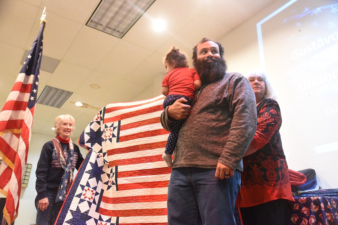 Gustavo Feliciano Jr., who served his country in the U.S. Army, smiles as he receives his Quilt of Valor from the Kootenai Valley Quilt Guild on Friday, Nov. 11, at the VFW Harper Erdman Post 1548. (Scott Shindledecker/The Western News)