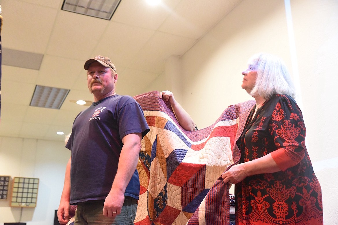 Jason Place, who served his country in the U.S. Army and Navy, received his Quilt of Valor from the Kootenai Valley Quilt Guild on Friday, Nov. 11, at the VFW Harper Erdman Post 1548. (Scott Shindledecker/The Western News)