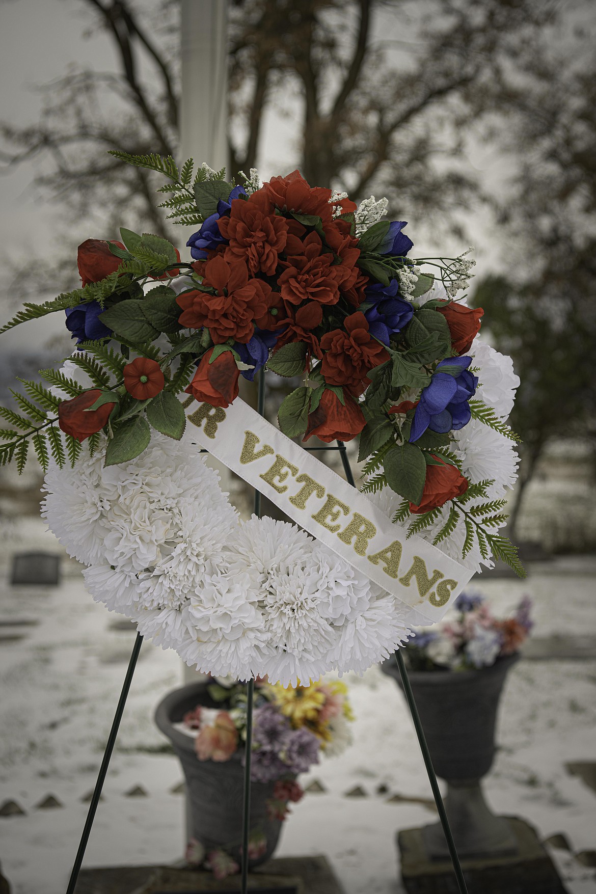 A wreath is placed during the ceremony. (Tracy Scott/Valley Press)