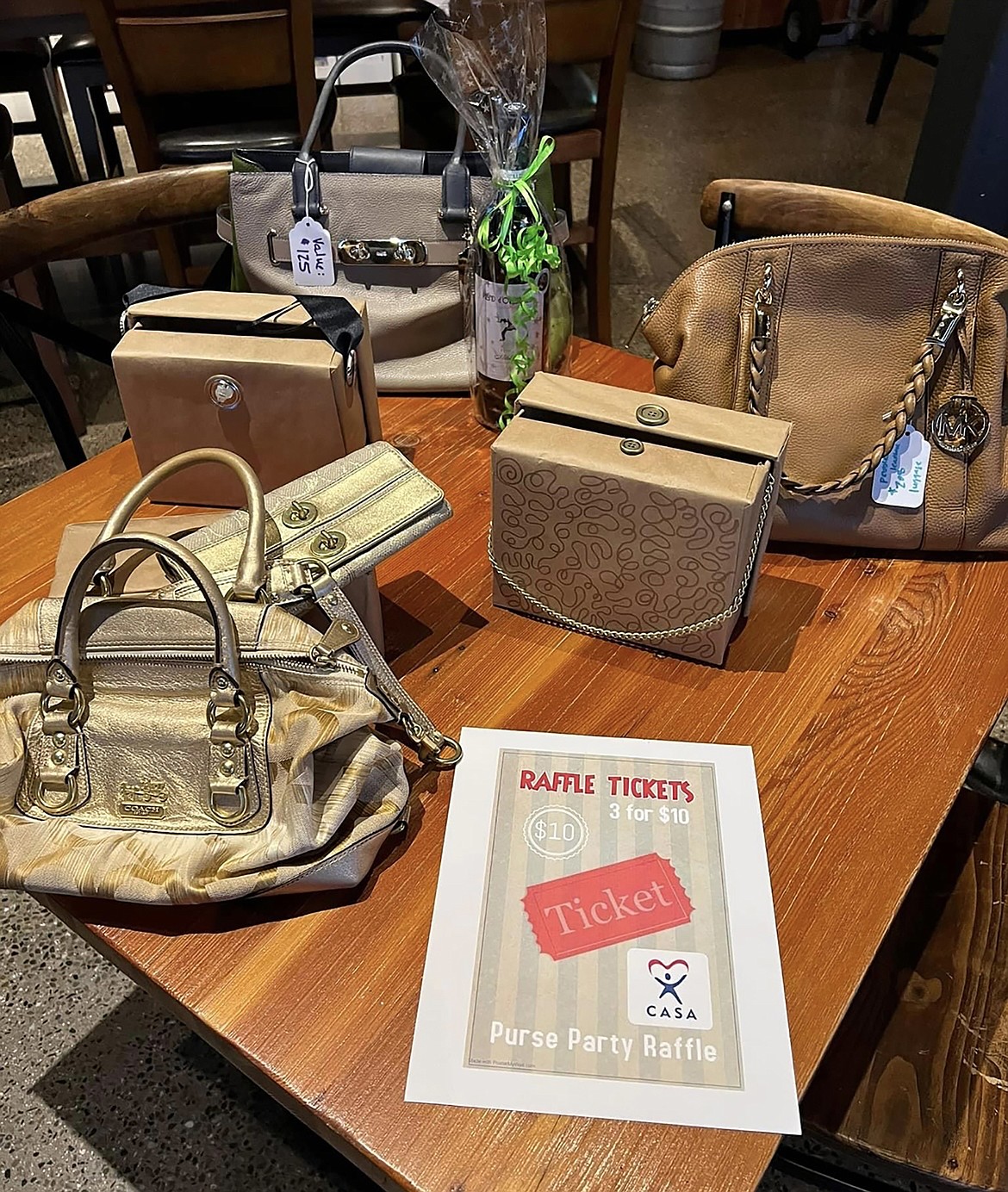 Several handbags available as part of a raffle at a past Purse Party event.