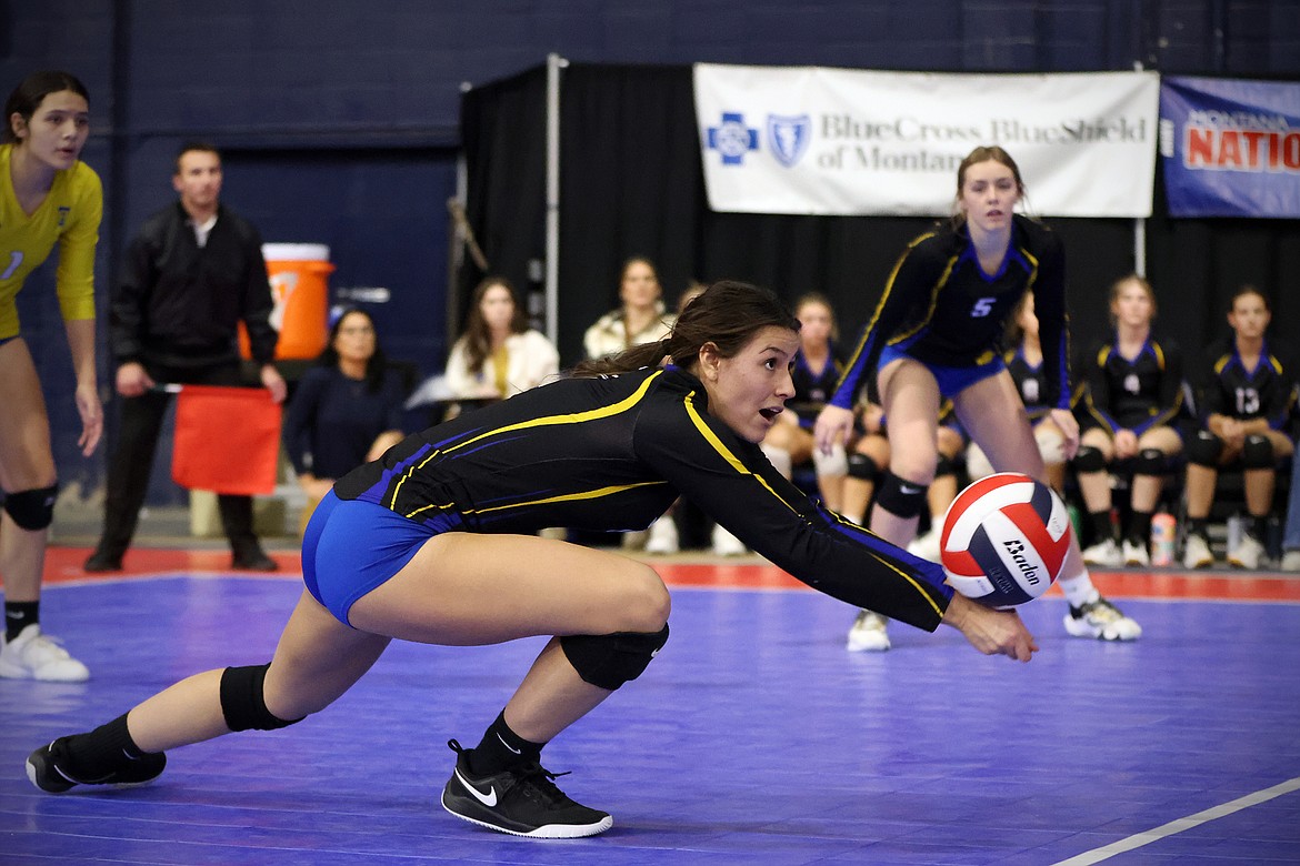 Avery Burgess makes a diving dig for the Lady Blue Hawks as Thompson Falls battled Glasgow at the All-Class State Volleyball Tournament in Bozeman Friday, Nov. 11. (Jeremy Weber/Daily Inter Lake)