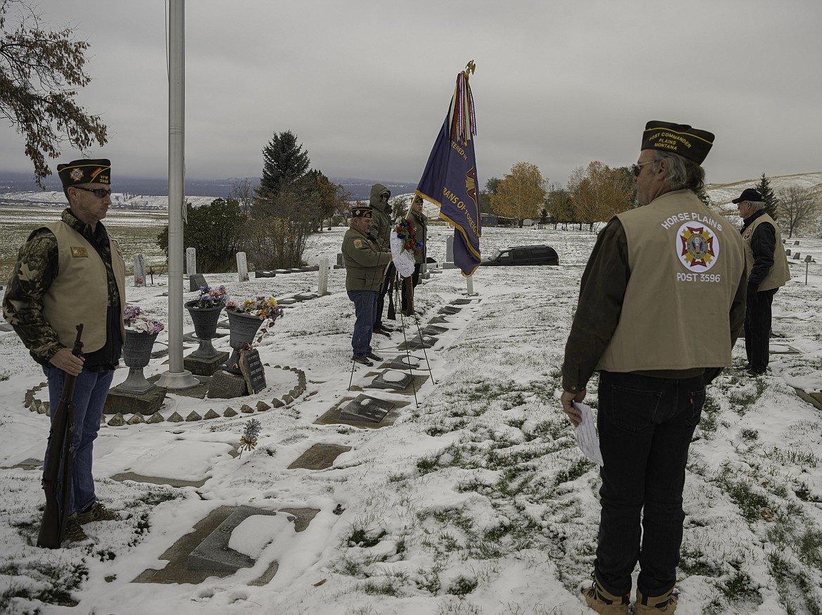 VFW members prepare for the presentation of the memorial wreath. (Tracy Scott/Valley Press)