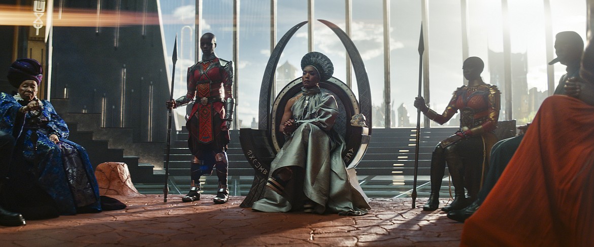 This image released by Marvel Studios shows, from left, Dorothy Steel as Merchant Tribe Elder, Florence Kasumba as Ayo, Angela Bassett as Ramonda, and Danai Gurira as Okoye in a scene from "Black Panther: Wakanda Forever."