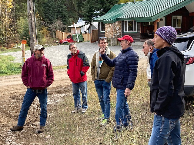 Brooke Lincoln (red hat) explains the history of the Saltese Trestle and what needs to be completed to restore it. To her right is Todd Smith, Jim Goss and Kevin Belanger. On her left is Bert Lindler and Amy Helena who is the Missoula Unit Manager, Department of Natural Resources. (Photo provided by Diane Magone)