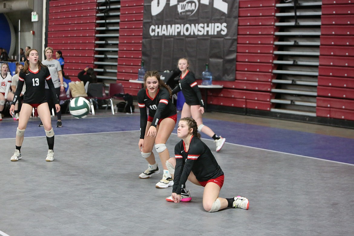 Junior Megan Melcher drops down to return a serve against La Conner in the quarterfinals of the 2B State Volleyball Tournament.