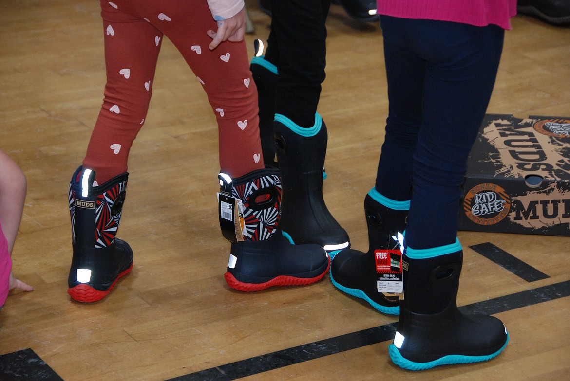 Southside Elementary student group together to show off their new boots, courtesy of the "Give Cold Feet the Boot" campaign.