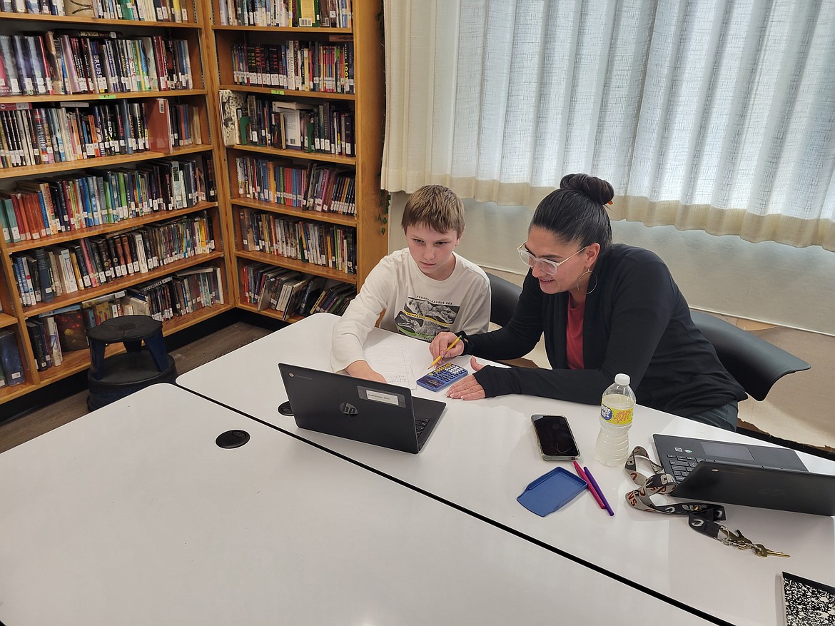 Evergreen After School PACK Program teacher Jennifer Corbett works with student River Engle-Knoble. (Courtesy photo)